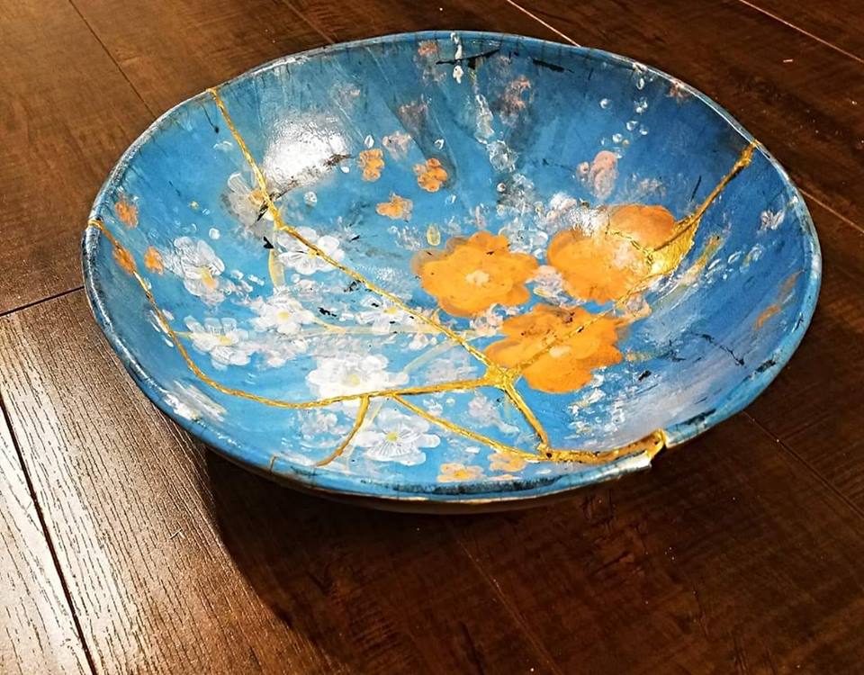 Hand-painted Kintsugi pottery bowl. Wikimedia Commons [Kintsugi, also known as kintsukuroi, is the Japanese art of repairing broken pottery by mending the areas of breakage with lacquer dusted or mixed with powdered gold, silver, or platinum]