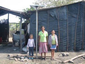 Doña Maria, her daughters and their solar panel.