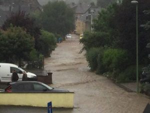 a street has become a stream during the 2021 German floods - view from my parents' window in Stolberg